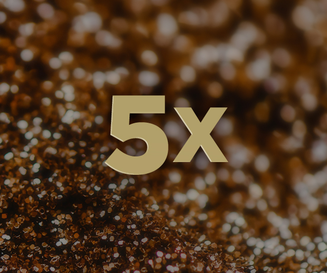 "5X" in the middle with blurred dark gold sequins in the background