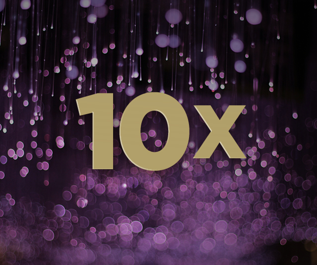 '10X' in the middle with blurred purple lights in the background